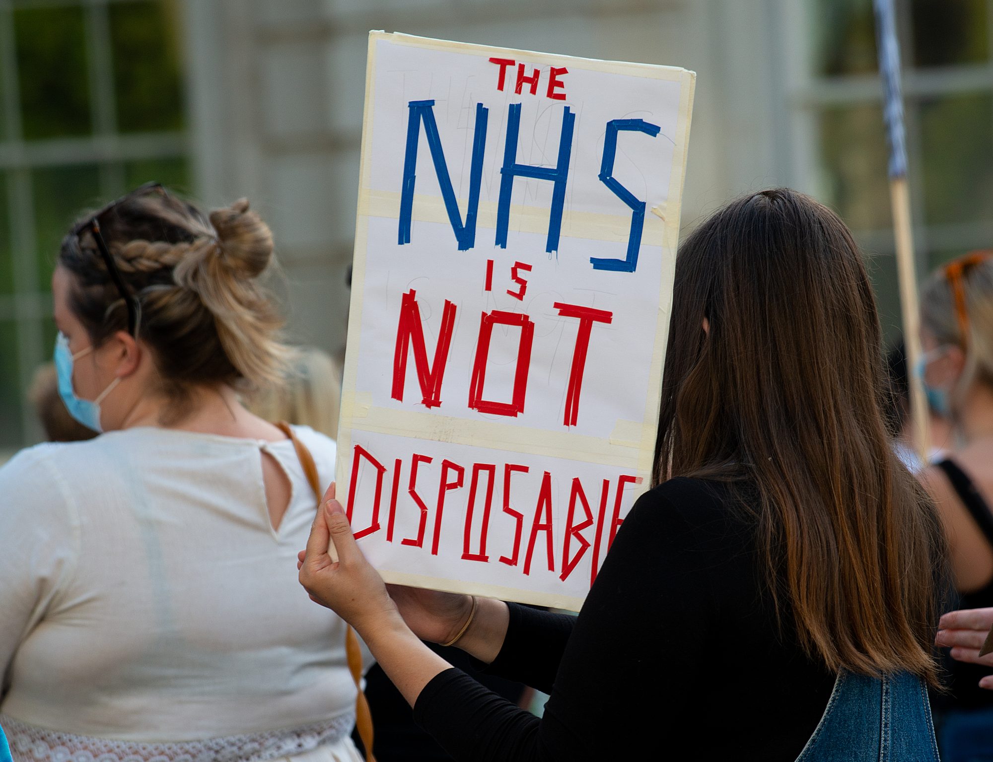 Sign reading 'THE NHS IS NOT DISPOSABLE'