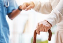 Walking stick, nurse and hands helping patient, support and therapy of disability, parkinson or arthritis. Cane, disabled old man and physiotherapy in nursing home, elderly healthcare or osteoporosis