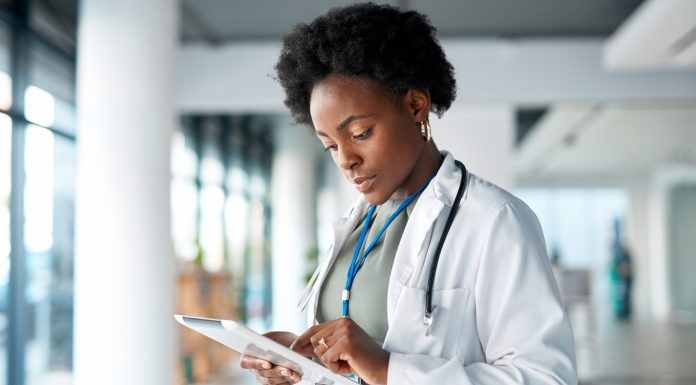 Healthcare, doctor and black woman on tablet in hospital for telehealth, research and online prescription. Hospital, clinic and female with digital tech for medical app, data analysis and insurance