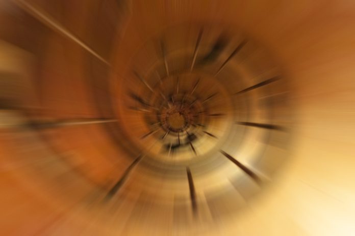 Abstract background from nature using motion, radial or zoom blur - metphor for vertigo, deep space, dizzy, unstable mental health illness, constrained, spinning wheel