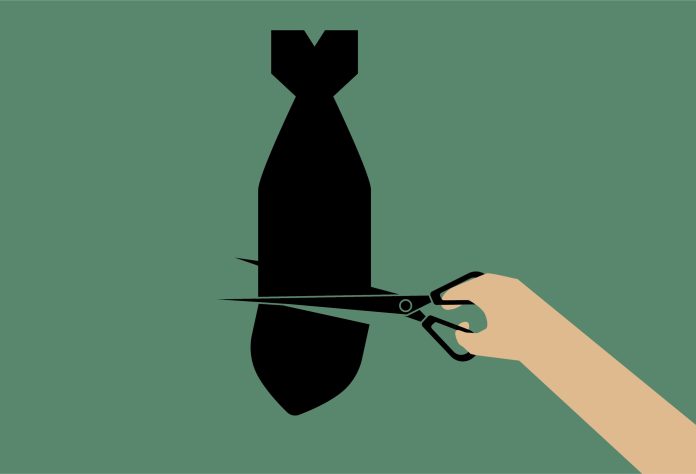 Cut the bomb with scissors, anti war, peace poster.