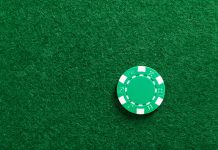 Single gambling chip on the table.