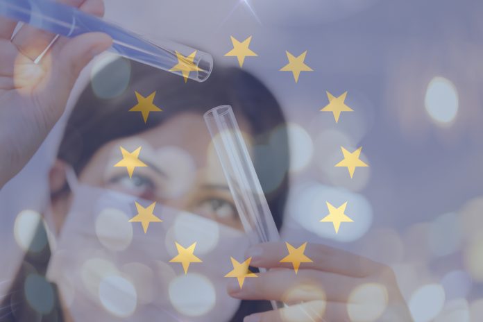 European union and vaccine, young chemical female researcher holding syringe and ampoule with fluid in laboratory. European union flag with female doctor Health expenditure