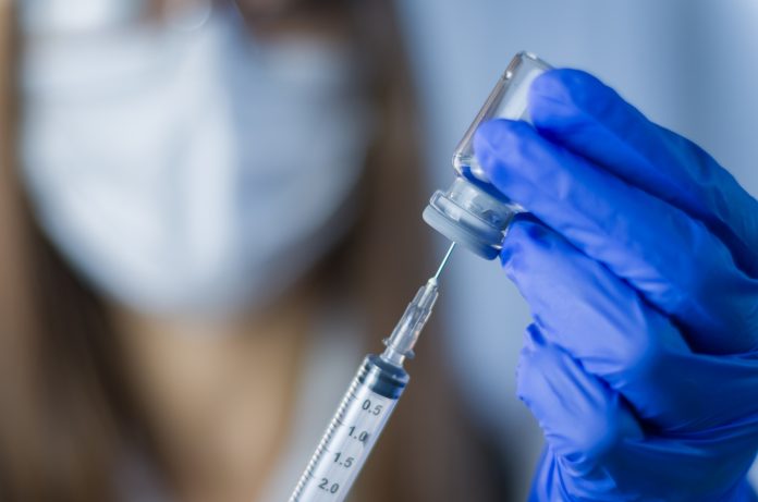 Vaccine in researcher hands