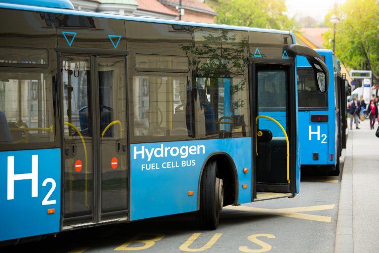 A hydrogen fuel cell buses stands at the station