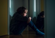 Sad boy at home. Depression or anxiety concept. - child poverty