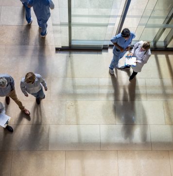 Patients and doctors coming in and out of the hospital