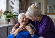 Woman hugging her elderly mother