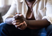 Close up of a pair of hands clasped together