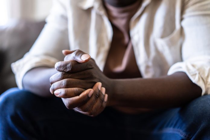 Close up of a pair of hands clasped together