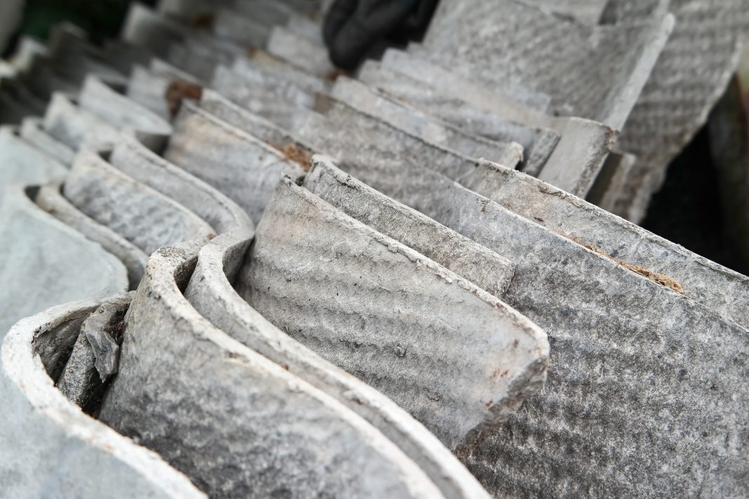 Stack of asbestos roofing sheets. Carcinogenic eternite.