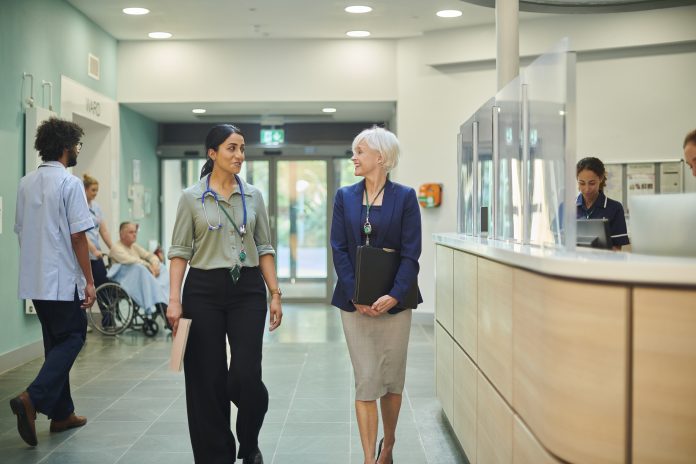 medical sales representative with female doctor