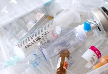 medical syringes and ampoules of plastic and glass that were in use, waste, close-up.