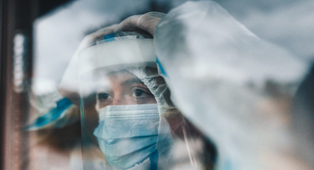 virologist at the window looking away