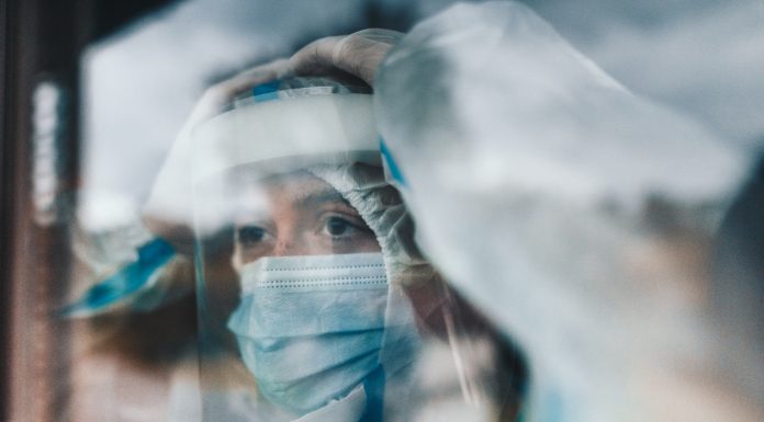 virologist at the window looking away