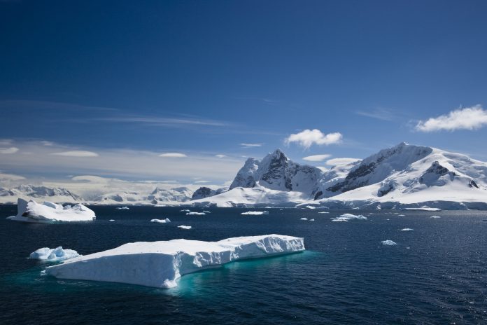 Ice and snowy mountains with water in the Paradise Harbour