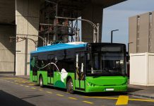 Electric bus charging at the charging pantograph.