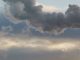 Heat station pipes, smoke. Smoking pipes, white smoke. Gray dramatic sky sky as background. Chimneys, concept of industry and ecology, heating season, global warming. Panoramic image