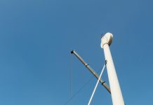 Low angle view of wind turbine being dismantled