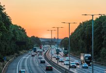 Sunset view of busy UK Motorway traffic in England