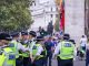 Happy laughing group of metropolitan police officers patrols the crowds of tourists in Whitehall in Westminster, London, UK