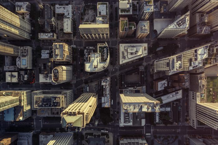 Overhead aerial view of Chicago Downtown skyscrapers. Urban grid with streets