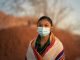 Navajo teenager portrait wearing a face mask during covid-19 pandemic