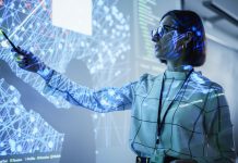 Young Female Teacher Giving a Data Science Presentation in a Dark Auditorium with Projecting Slideshow with Artificial Intelligence Neural Network Architecture. Business Startup and Education Concept