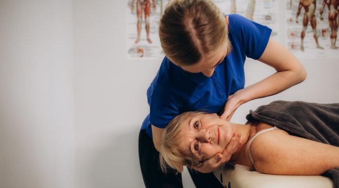 senior woman at an appointment with a chiropractor