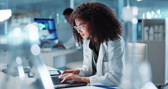 Woman. laptop and lab for research science or online internet for futuristic discovery, microscope or medicine. Female person, brainstorming and biotechnology for investigation, cure or development