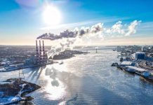 On the left is an aerial view of Halifax Harbour with a local power plant, as indicated by the three cooling towers. Credit: Noah James Media