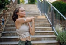 Beautiful diabetic woman preparing for outdoor run in the city.