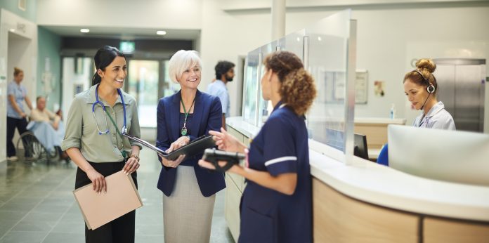 medical administrator with female doctor and ward nurse