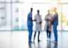 Blurred shot of a team of doctors standing together in a hospital