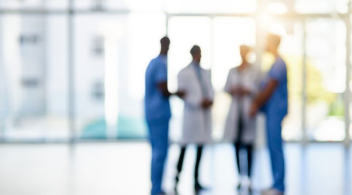 Blurred shot of a team of doctors standing together in a hospital