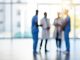 Blurred shot of a team of doctors standing together in a hospital