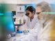 Female Scientist Working in The Lab, Using Microscope