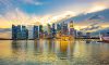 Moody Sky at Sunset over the Office Buildings with Reflection in Marina Bay