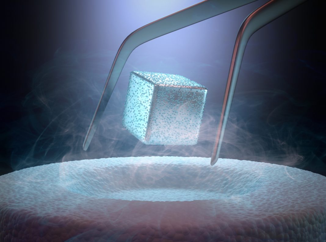 Image concept of magnetic levitating above a high-temperature superconductor, cooled with liquid nitrogen.