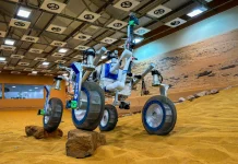 A test rover with shape memory alloy spring tires traverses rocky, Martian-simulated terrain. Credit © NASA