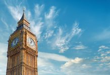 Big Ben Clock Tower in London, UK, on a bright day. Panoramic composition withcopy-space, text space on blue sky with feather clouds.