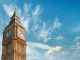 Big Ben Clock Tower in London, UK, on a bright day. Panoramic composition withcopy-space, text space on blue sky with feather clouds.