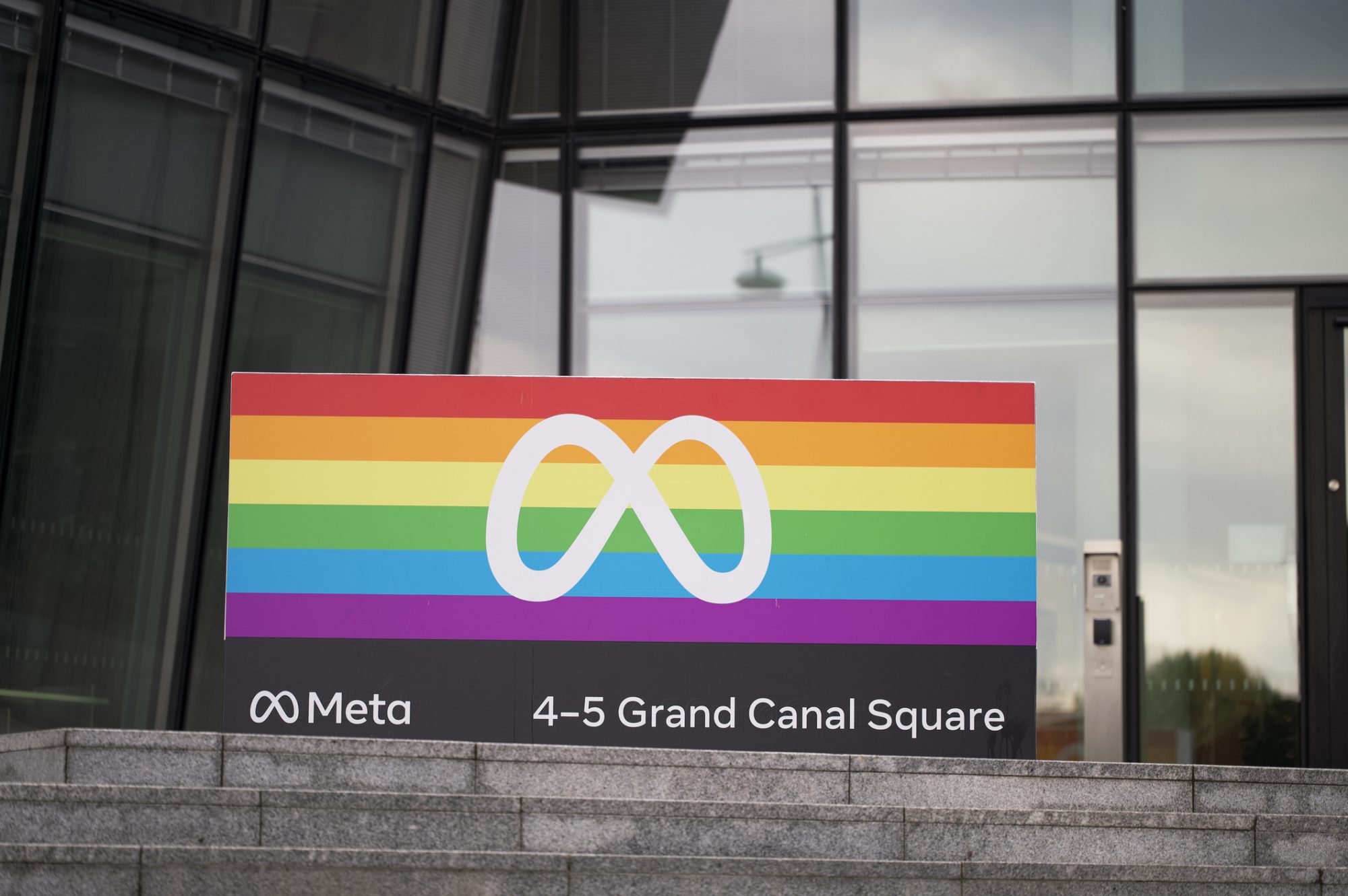 Dublin, Ireland - September 2, 2022: Meta office building sign in front of office building on Grand Canal Quay Square in downtown Dublin, Ireland.