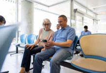 Senior woman with a companion in the waiting room at the hospital