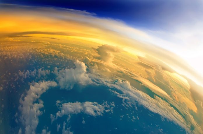 "Aerial view of Planet Earth with clouds, horizon and little bit of space, make feelings of being in heaven. Dramatic clouds and orange sunlight all over the planet. Cloudscape and stratosphere from above at 30000 feet.See more images like this in:"