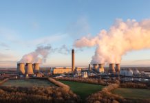 Drax coal fired power station in UK with coal stack and biofuel storage tanks for clean energy production