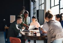 Diverse Team Working Together in Modern Co-Working Space