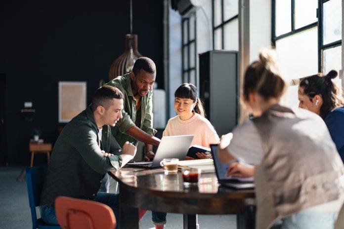 Diverse Team Working Together in Modern Co-Working Space