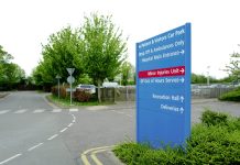 Typical NHS styled information sign seen adjacent to an outpatient car park in a British hospital.