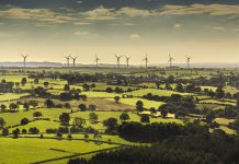 Wind turbines and farmland near Leeds, West Yorkshire. Aerial view from a helicopter